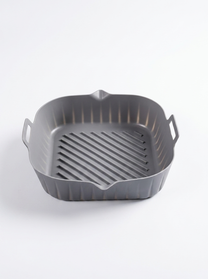 Gray grill pan with handles on a white background