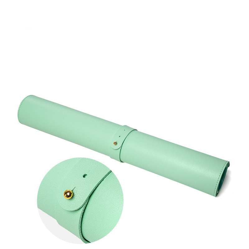 Mint green travel case with a round lid on a white background