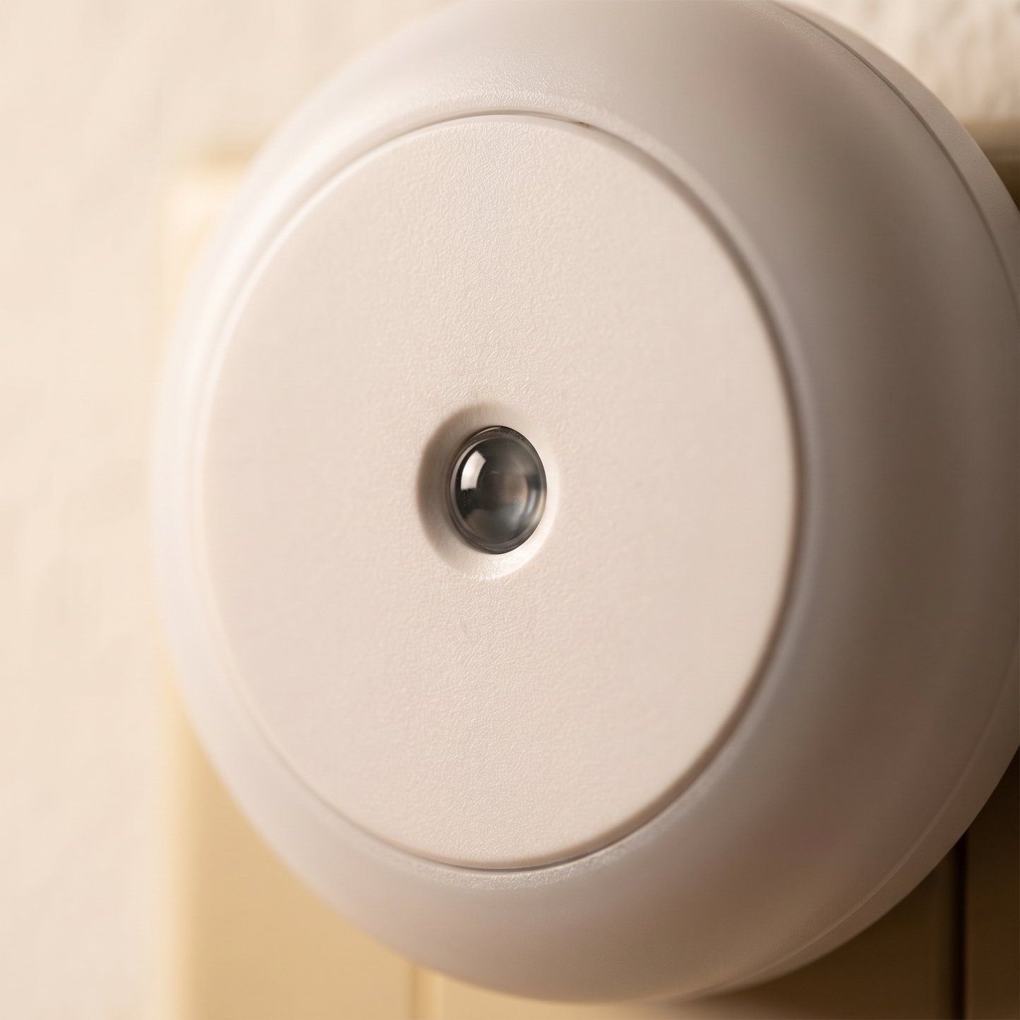 Close-up detail of Petty Pet DuskSense Plug-In Night Light photosensor and diffuser