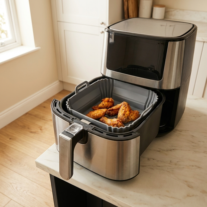 Petty Pet FlexFry Silicone Air Fryer Liner in use inside an air fryer drawer in a UK kitchen